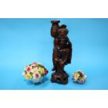 An Oriental carved rootman figure and two posy holders