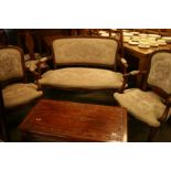 A French style three piece suite; comprising pair of armchairs and two seater sofa