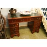 A reproduction mahogany twin pedestal desk. 122cm x 60cm