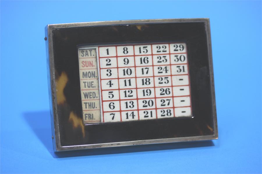 A silver mounted rectangular calendar