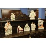 A collection of seven various Staffordshire flat back figures