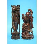 Two Oriental carved rootman figures. 35cm and 31cm high