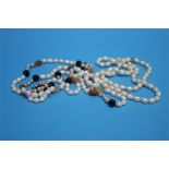 Two strands of freshwater pearls, one set with hardstones