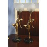 A pair of Art Deco style figural lamps