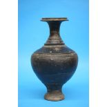 A large unusual black glazed earthenware Oriental vase. 38 cm high