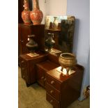 A mahogany four piece bedroom suite