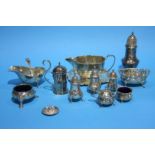 A small silver waiter, two silver sauceboats, an oval silver dish, a sugar sifter etc. Total