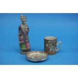 A Chinese canton enamelled tankard, a small shallow dish and a Chinese figure of a Deity. (3)