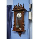 A walnut cased wall clock