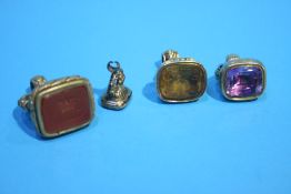Four various 19th century fobs, one showing hunting dogs