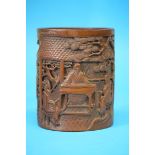 A Chinese 19th Century bamboo brush pot carved with various figures in a pavilion, signed. 16.5 cm