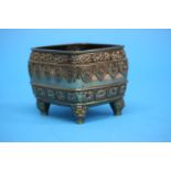 A Chinese gilt polished bronze censer decorated with dragon designs. 10 cm wide by 8.5 cm high