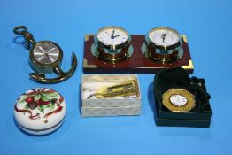 A boxed Gucci Quartz digital watch, a Hermes of Paris anchor shaped barometer, an Asprey boxed