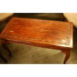 An Oriental style hardwood coffee table