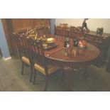 An Edwardian oval mahogany dining table and four chairs