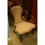 A mahogany spoon back nursing chair