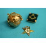 Two gold masonic charms and a masonic ball