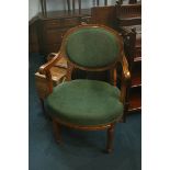 A pair of Edwardian oak arm chairs