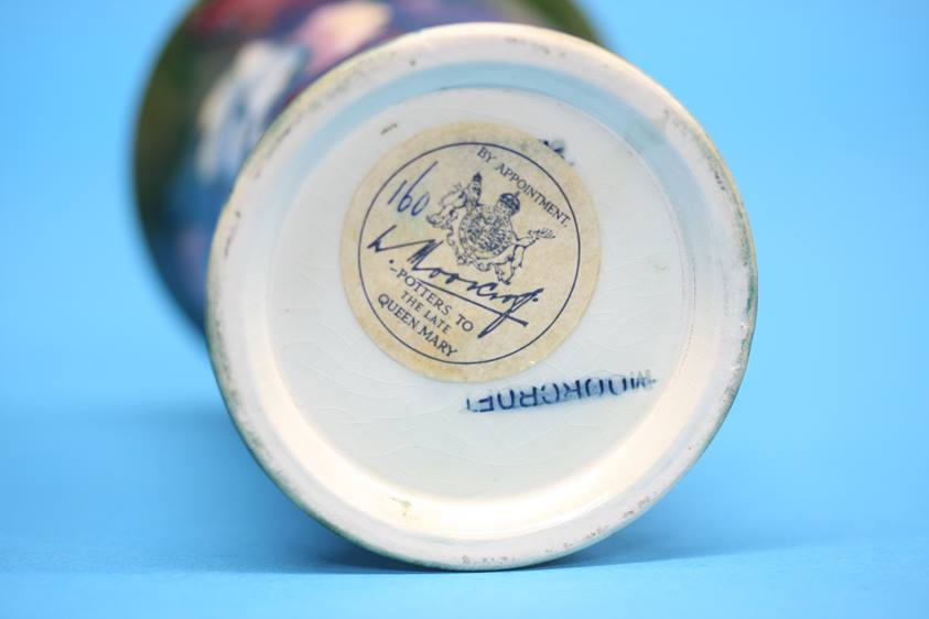 A Moorcroft vase on a blue ground, decorated with pansies and another on green ground decorated with - Image 5 of 8