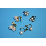 A pair of 18ct gold mounted pearl earrings and two other pairs
