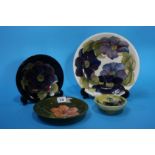Four various Moorcroft circular plates and dishes, various sizes