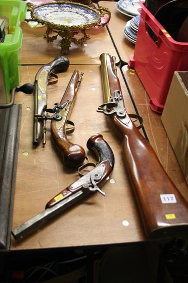 A reproduction blunderbuss, 2 flintlocks etc.