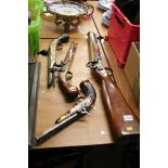 A reproduction blunderbuss, 2 flintlocks etc.