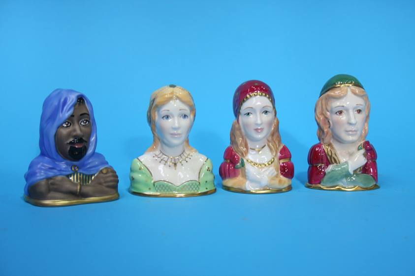 A set of four Royal Worcester Shakespeare candle snuffers