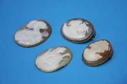 Two gold Cameo brooches and two loose cameos