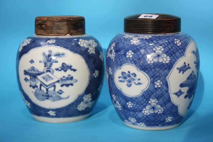 Two blue and white ginger jars with turned wood covers