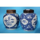 Two blue and white ginger jars with turned wood covers
