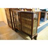 A mahogany bow front china cabinet