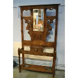 A heavily carved oak hallstand. 107cm x 30cm x 198cm