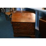 A miniature oak fall front bureau. 67cm x 35cm x 78cm