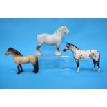 A Beswick Palomino, a Grey Shire and another