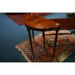 A reproduction mahogany half moon side table