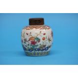 A famille rose ginger jar and cover, Yongzheng style, decorated with flowers. 11 cm high