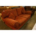 A terracotta two seater sofa