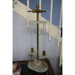 A Perspex Table lamp with brass dolphins