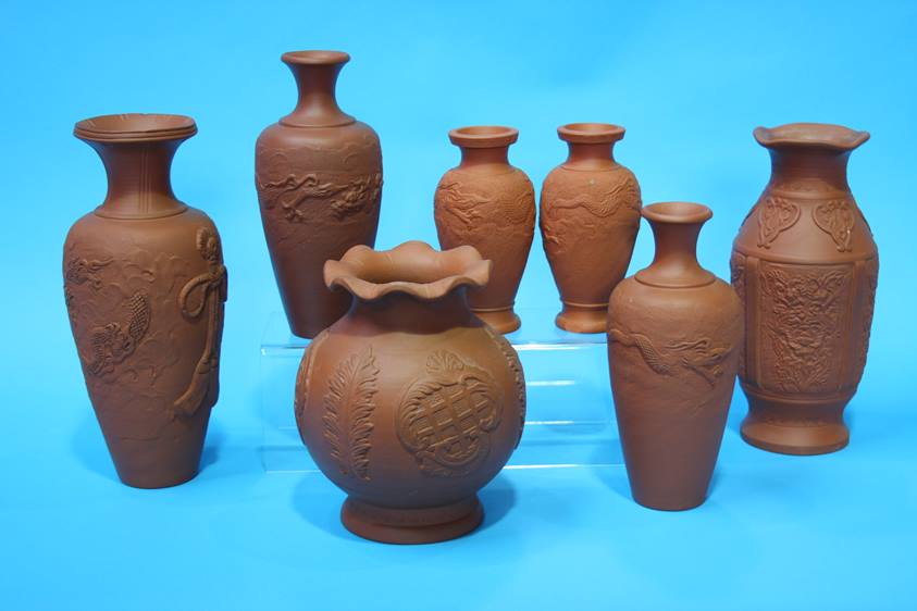 Seven various 20th Century Oriental terracotta vases