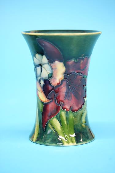 A Moorcroft vase on a blue ground, decorated with pansies and another on green ground decorated with - Image 6 of 8