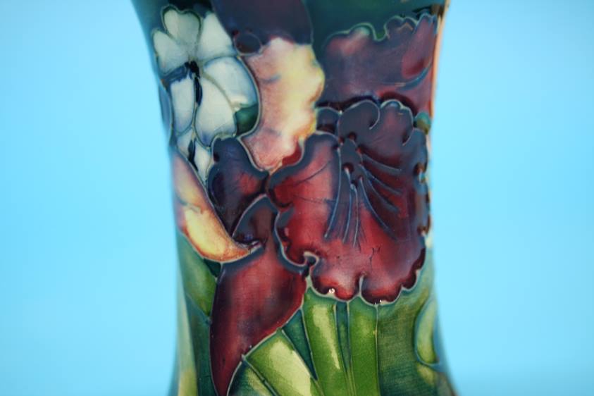 A Moorcroft vase on a blue ground, decorated with pansies and another on green ground decorated with - Image 8 of 8