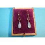 A pair of white gold drop earrings, each set with