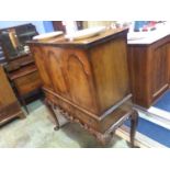 A walnut three door Cocktail cabinet on cabriole legs