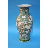 An Oriental vase with panels, decorated with birds