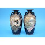 A pair of 1920/1930's Satsuma vases decorated with panels of landscapes etc. 25cm height