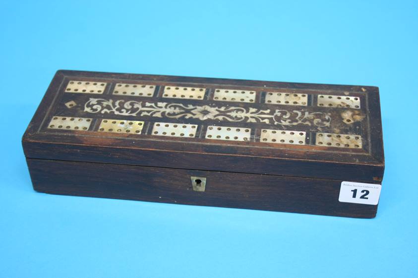 A 19th Century Rosewood domino set, the top with mother of pearl inset panels, opening to reveal