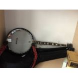 A Deville banjo and soft case