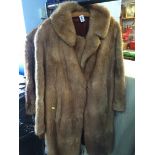 Three quarter length fur coat
