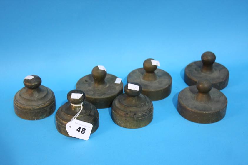 Seven brass Draftsman's weights